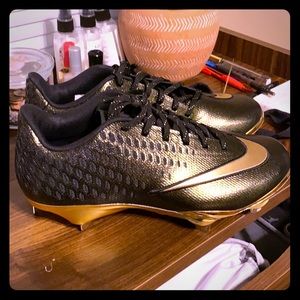 Gold and black nike cleats size 7.5